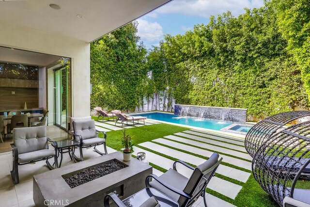 737 N Cherokee Ave, Los Angeles, CA 90038 - view of patio with a grill, an outdoor fire pit, and an outdoor pool