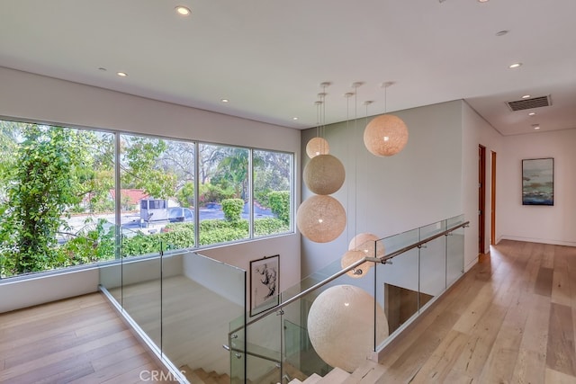 737 N Cherokee Ave, Los Angeles, CA 90038 - hall with an upstairs landing, visible vents, recessed lighting, and wood-type flooring