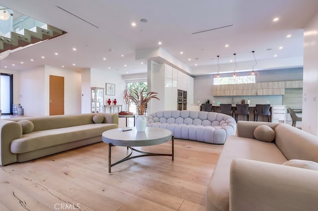737 N Cherokee Ave, Los Angeles, CA 90038 - living room featuring light wood finished floors and recessed lighting