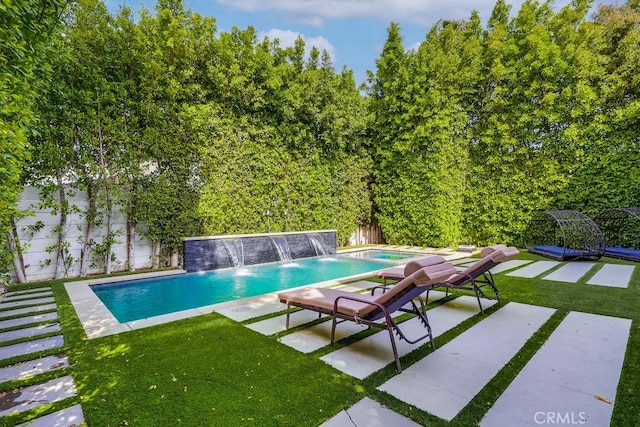 737 N Cherokee Ave, Los Angeles, CA 90038 - view of pool featuring a patio, a fenced in pool, a fenced backyard, and a yard