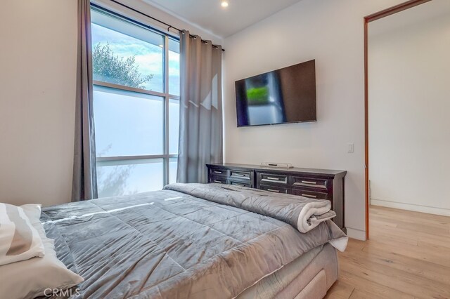 737 N Cherokee Ave, Los Angeles, CA 90038 - bedroom with baseboards, recessed lighting, and light wood-style floors
