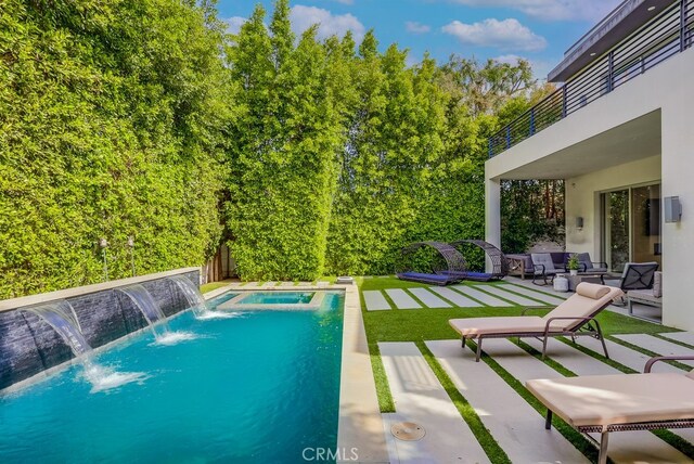 737 N Cherokee Ave, Los Angeles, CA 90038 - outdoor pool with fence, an outdoor living space, and a patio area