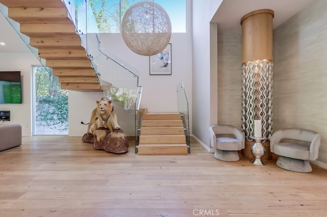 737 N Cherokee Ave, Los Angeles, CA 90038 - interior space featuring wood finished floors and a towering ceiling