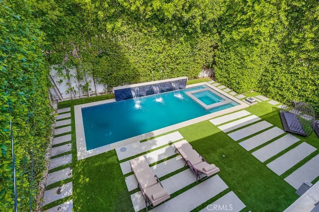 737 N Cherokee Ave, Los Angeles, CA 90038 - view of swimming pool with a yard, a pool with connected hot tub, and fence private yard