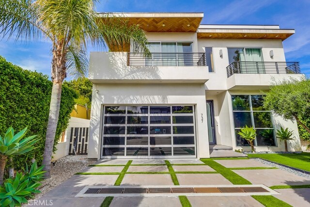 737 N Cherokee Ave, Los Angeles, CA 90038 - view of front of home with a balcony and stucco siding