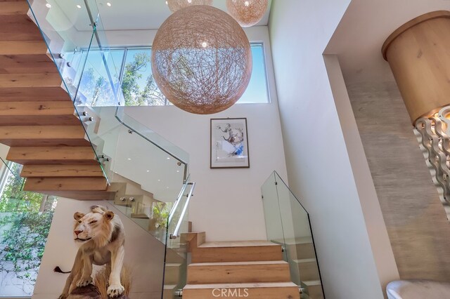 737 N Cherokee Ave, Los Angeles, CA 90038 - stairs with a high ceiling and plenty of natural light