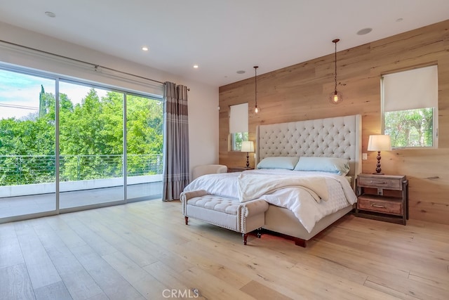 737 N Cherokee Ave, Los Angeles, CA 90038 - bedroom featuring light wood-style floors, wood walls, and access to outside