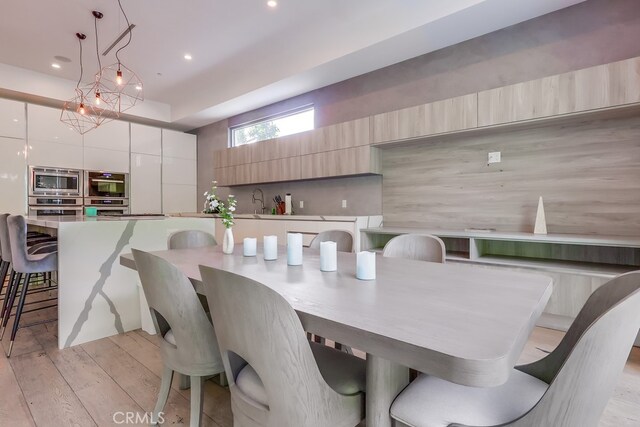 737 N Cherokee Ave, Los Angeles, CA 90038 - dining room featuring recessed lighting and light wood-type flooring
