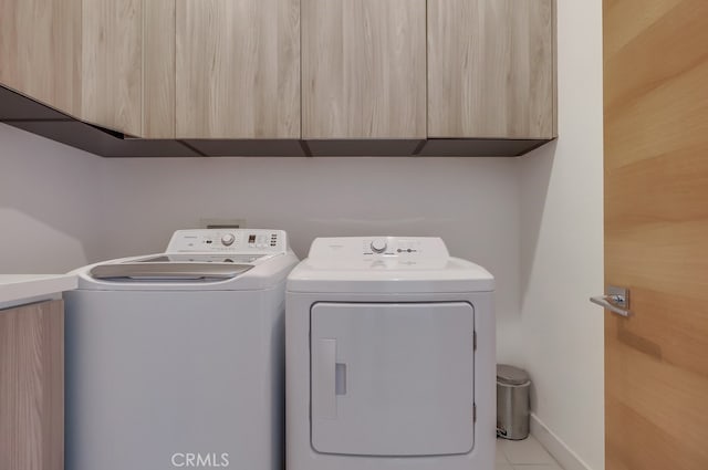 737 N Cherokee Ave, Los Angeles, CA 90038 - laundry area featuring cabinet space, washing machine and dryer, and baseboards