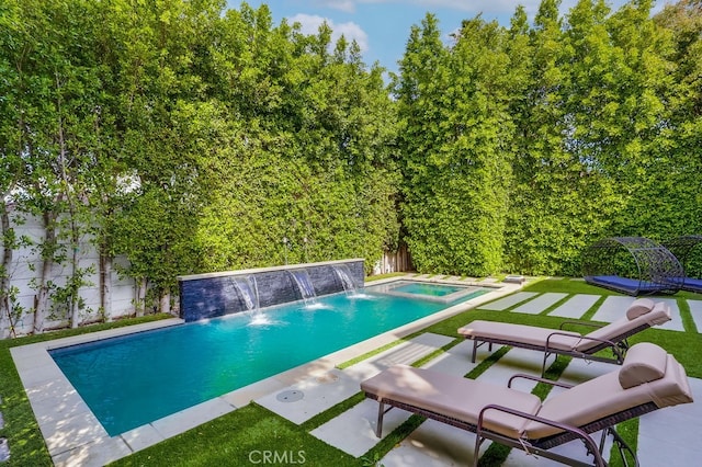 737 N Cherokee Ave, Los Angeles, CA 90038 - pool featuring a patio area, a fenced backyard, and an in ground hot tub