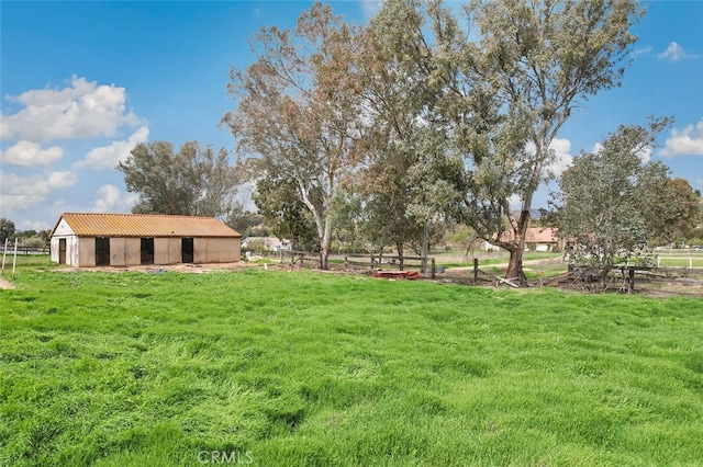 view of yard with an exterior structure and an outbuilding