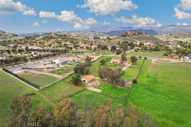 birds eye view of property with a mountain view