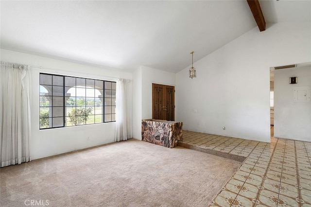 empty room featuring beamed ceiling, visible vents, high vaulted ceiling, and carpet