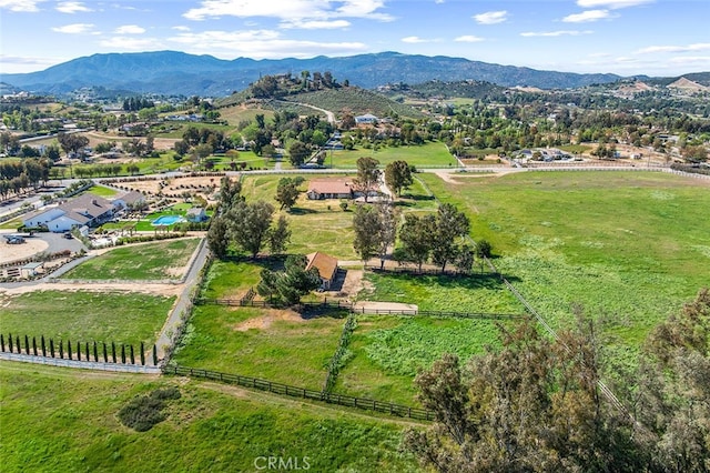 drone / aerial view featuring a rural view and a mountain view