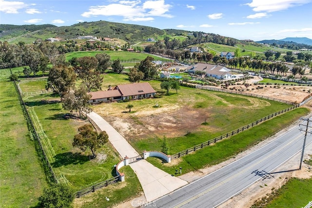 drone / aerial view with a mountain view and a rural view