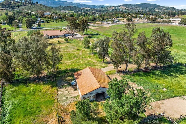 drone / aerial view featuring a mountain view and a rural view