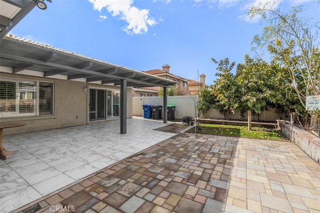 view of patio / terrace with a fenced backyard and a pergola