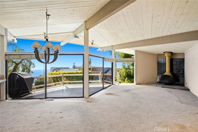 view of patio with a fireplace and a grill