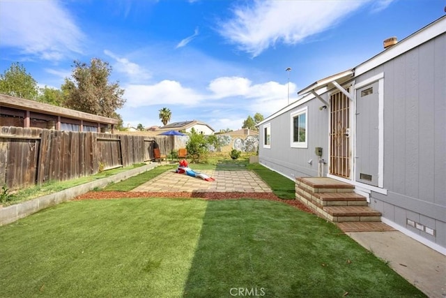view of yard with a patio and fence