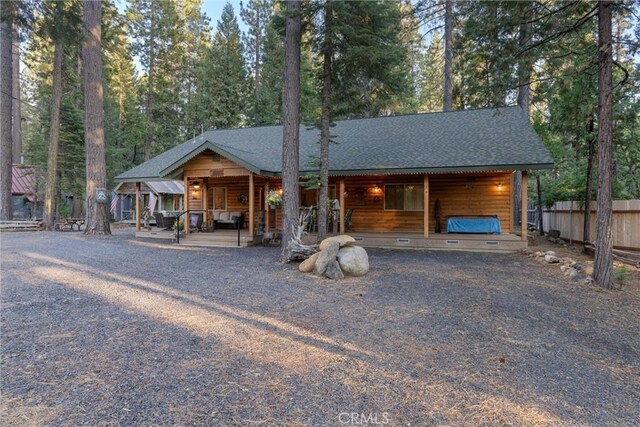 7528 Humboldt Rd, Butte Meadows, CA 95942 - view of front of home featuring fence, covered porch, and roof with shingles