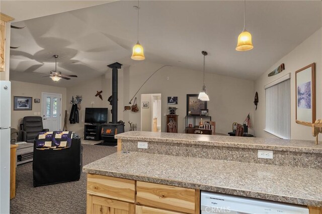 7528 Humboldt Rd, Butte Meadows, CA 95942 - kitchen with lofted ceiling, open floor plan, a wood stove, white appliances, and carpet flooring
