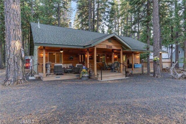 7528 Humboldt Rd, Butte Meadows, CA 95942 - rear view of property featuring a shingled roof, faux log siding, and a porch