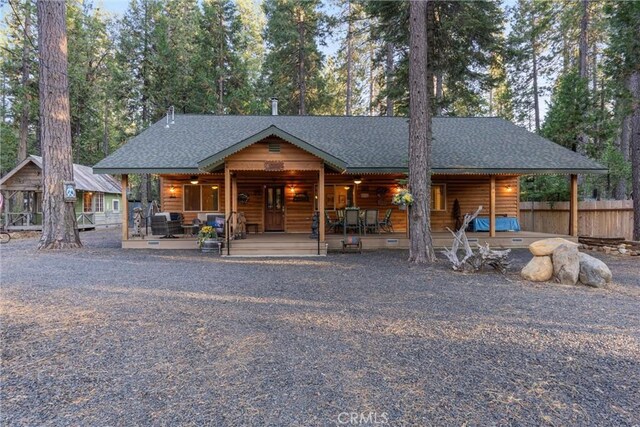 7528 Humboldt Rd, Butte Meadows, CA 95942 - view of front of house with roof with shingles, fence, and covered porch