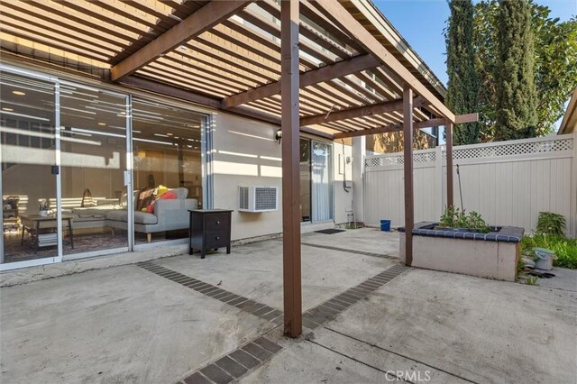 view of patio / terrace with visible vents, fence, and a pergola