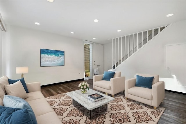 living room featuring recessed lighting, stairway, baseboards, and wood finished floors
