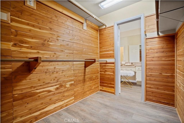 spacious closet with wood finished floors