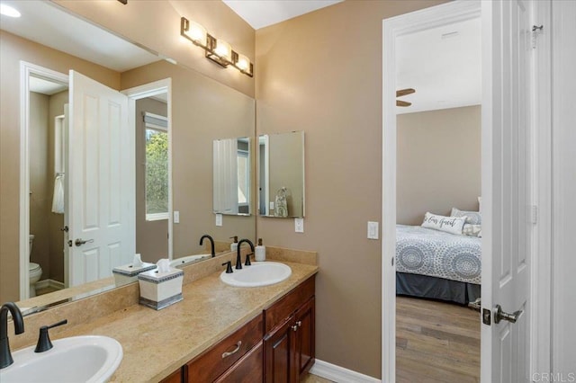 16270 Pauma Valley Dr, Pauma Valley, CA 92061 - full bath with double vanity, ensuite bath, and wood finished floors
