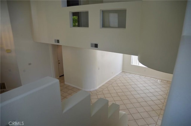 24391 Rue De Gauguin, Laguna Niguel, CA 92677 - tiled empty room featuring visible vents, baseboards, and plenty of natural light