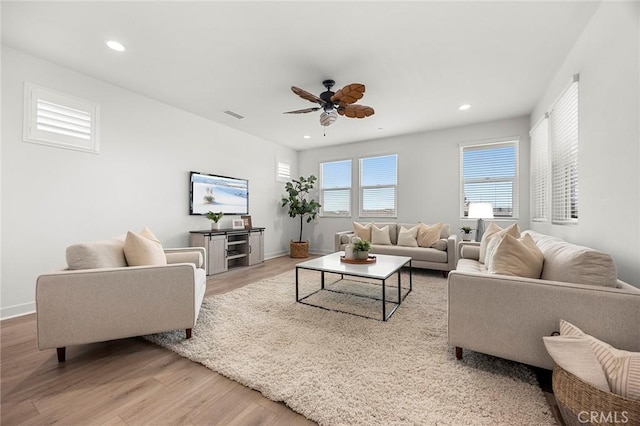 living room featuring a ceiling fan, recessed lighting, wood finished floors, and visible vents