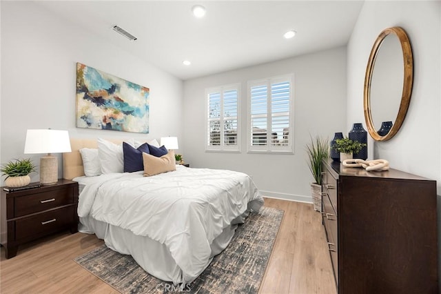 bedroom with recessed lighting, baseboards, visible vents, and light wood-style flooring