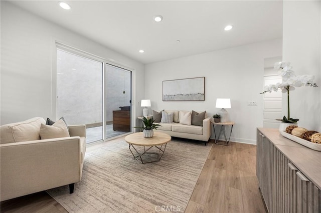 living area featuring recessed lighting and light wood-type flooring