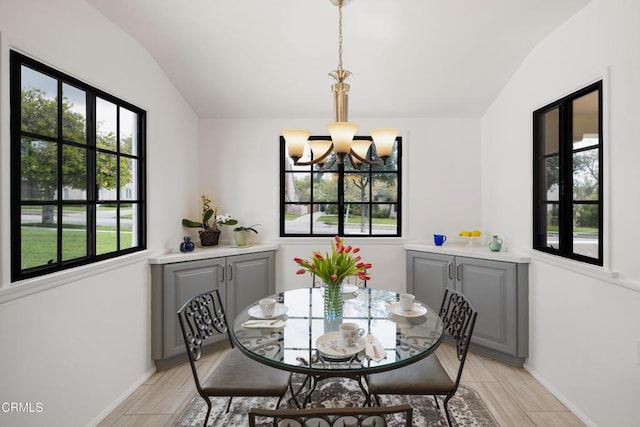 1441 Cleveland Rd, Glendale, CA 91202 - dining room with wood finish floors, lofted ceiling, a chandelier, and a wealth of natural light