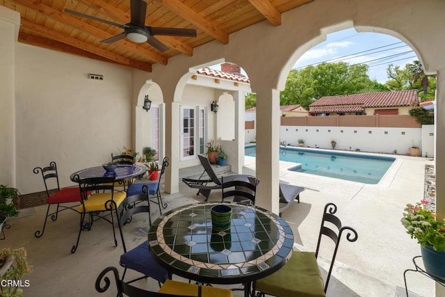 1441 Cleveland Rd, Glendale, CA 91202 - view of patio / terrace with a fenced backyard, outdoor dining area, ceiling fan, and a fenced in pool