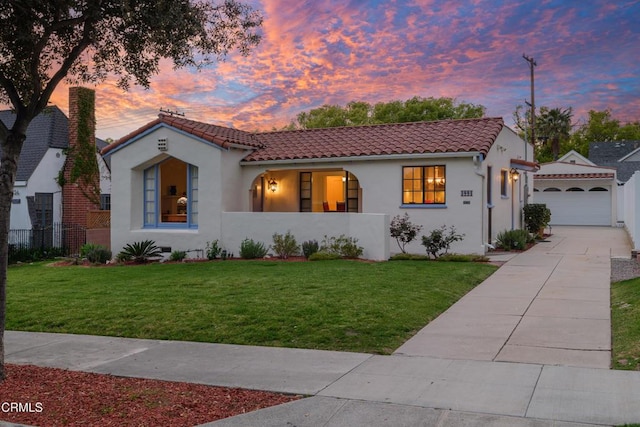1441 Cleveland Rd, Glendale, CA 91202 - mediterranean / spanish-style house with fence, a tiled roof, a garage, a front lawn, and stucco siding