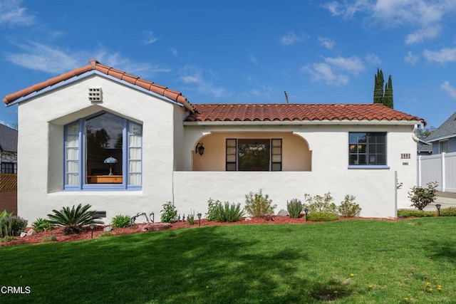 1441 Cleveland Rd, Glendale, CA 91202 - mediterranean / spanish home with stucco siding, a tile roof, fence, and a front yard