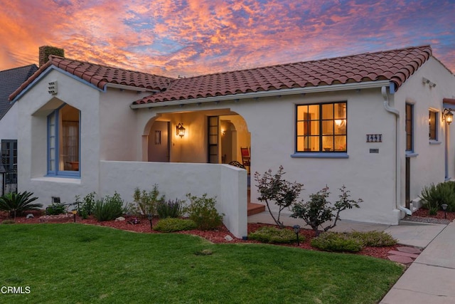 1441 Cleveland Rd, Glendale, CA 91202 - mediterranean / spanish home with a tiled roof, stucco siding, and a lawn