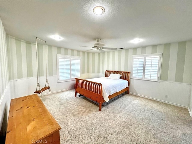 41559 Floyd Ct, Temecula, CA 92592 - bedroom featuring wallpapered walls, carpet flooring, wainscoting, and a ceiling fan