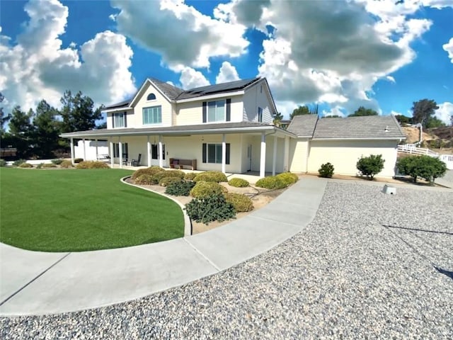 41559 Floyd Ct, Temecula, CA 92592 - farmhouse-style home with solar panels, a front lawn, and covered porch