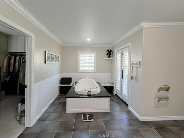 41559 Floyd Ct, Temecula, CA 92592 - bathroom featuring a garden tub, crown molding, a spacious closet, tile patterned flooring, and a wainscoted wall