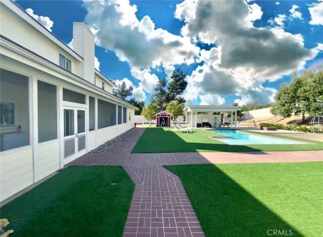 41559 Floyd Ct, Temecula, CA 92592 - view of green lawn featuring a patio and a swimming pool