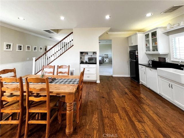 41559 Floyd Ct, Temecula, CA 92592 - dining area featuring ornamental molding, dark wood finished floors, recessed lighting, stairway, and a wainscoted wall