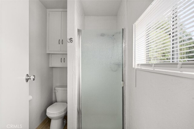 282 E 8th St, Chico, CA 95928 - bathroom featuring toilet and a stall shower