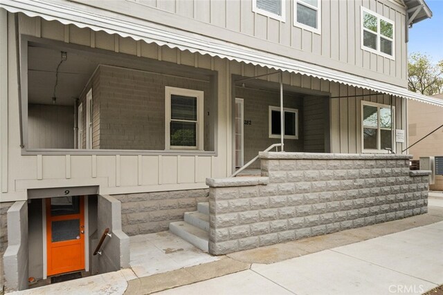 282 E 8th St, Chico, CA 95928 - entrance to property featuring covered porch and board and batten siding
