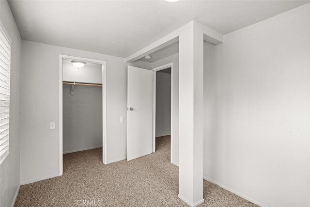 282 E 8th St, Chico, CA 95928 - unfurnished bedroom with baseboards, carpet, a closet, and a spacious closet