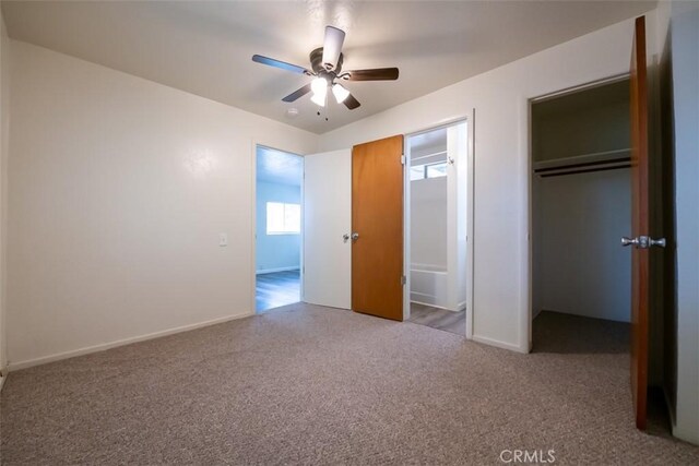 282 E 8th St, Chico, CA 95928 - unfurnished bedroom with baseboards, ceiling fan, carpet, and a closet