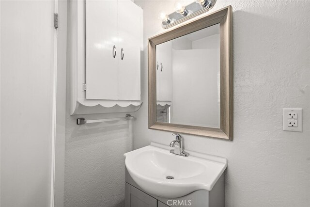 282 E 8th St, Chico, CA 95928 - bathroom with vanity and a textured wall